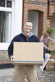 Loading items into a moving van for a Harrow man with van service