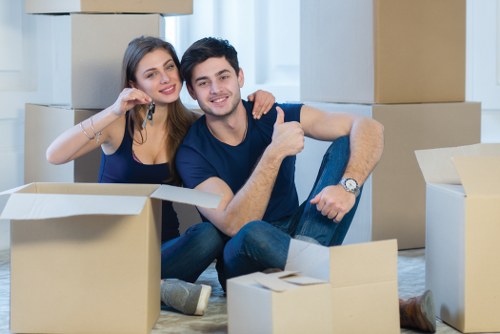 Removal team handling office furniture and equipment during a Harrow relocation