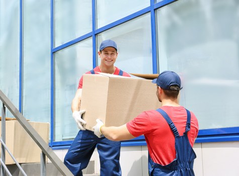Careful wrapping of fragile belongings during a Harrow move