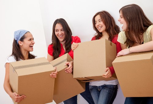 Local piano movers loading a piano safely into a removals vehicle