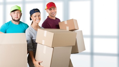 Loading boxes and furniture into a removal van in Harrow