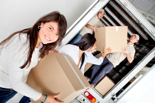 Loading boxes and furniture into a moving van